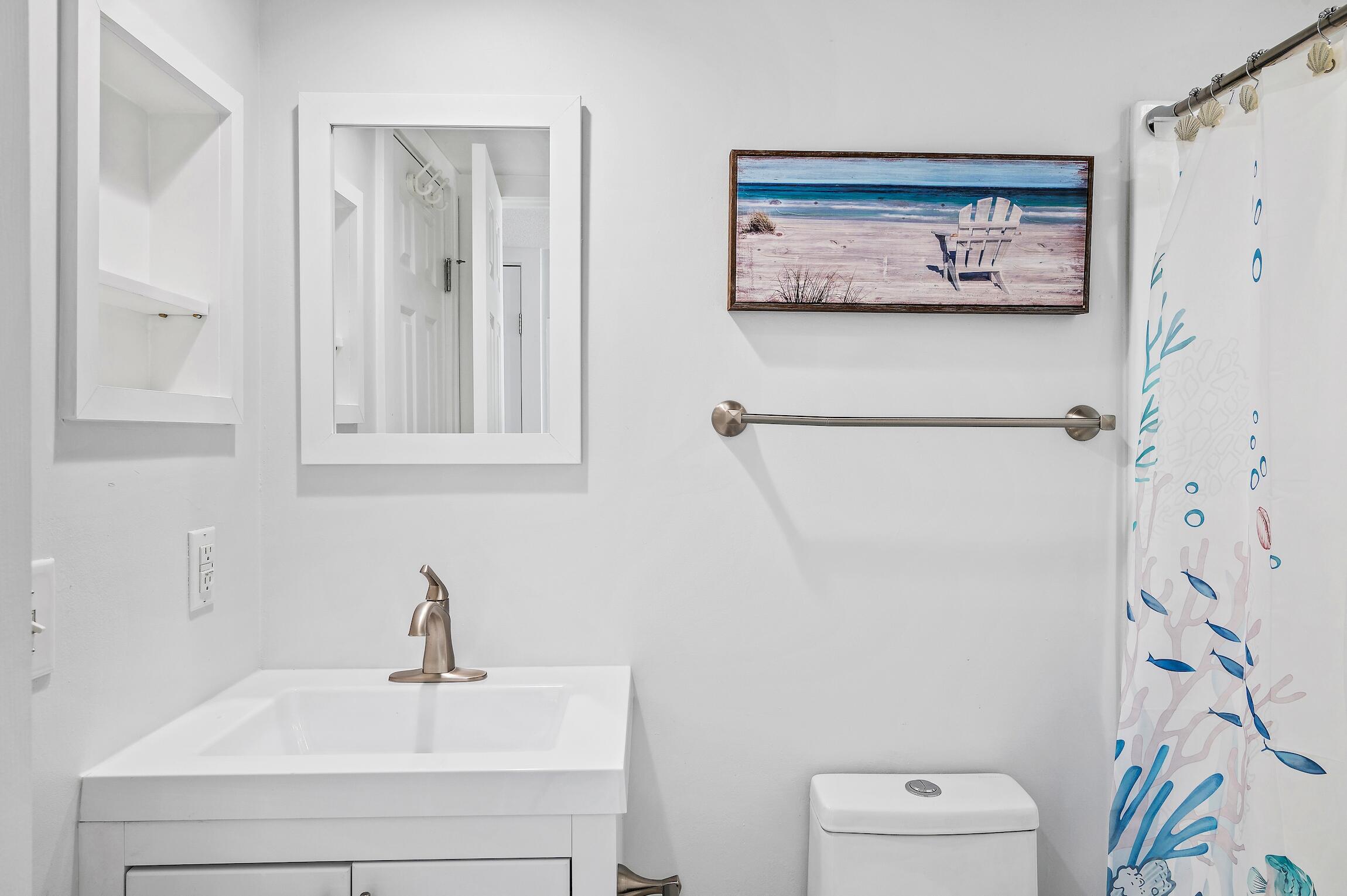 4100 East County Highway 30A, Unit 1805 Santa Rosa Beach, FL 32459 - Photo 16 of 35 a bathroom with a sink and a mirror