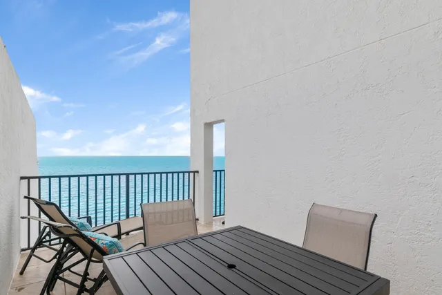 a wooden bench sitting on top of a wooden roof