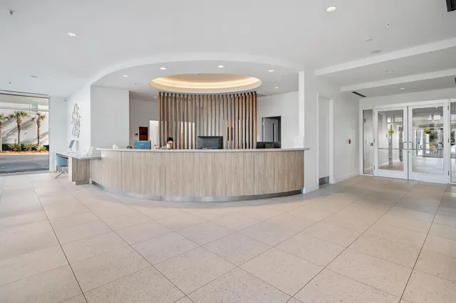 a view of a house with a large window and chandelier