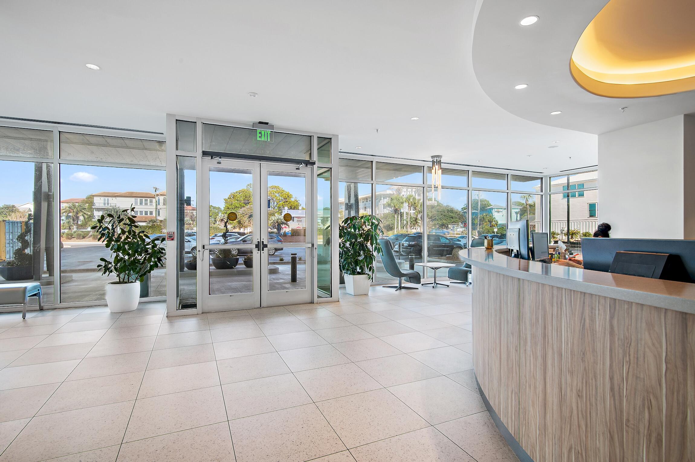4100 East County Highway 30A, Unit 1805 Santa Rosa Beach, FL 32459 - Photo 25 of 35 a view of a dining room with furniture a potted plant and chandelier