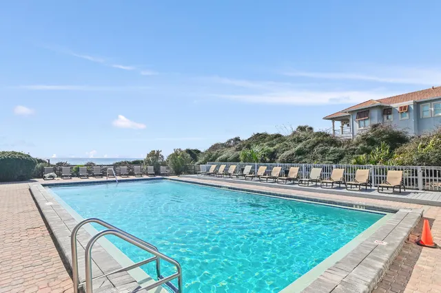 a view of a swimming pool with a terrace