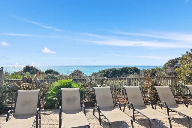 a view of a terrace with furniture and city view
