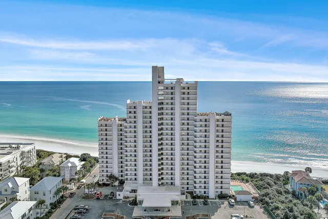 a view of ocean with a multi story building