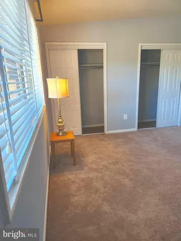 a view of an empty room and a window