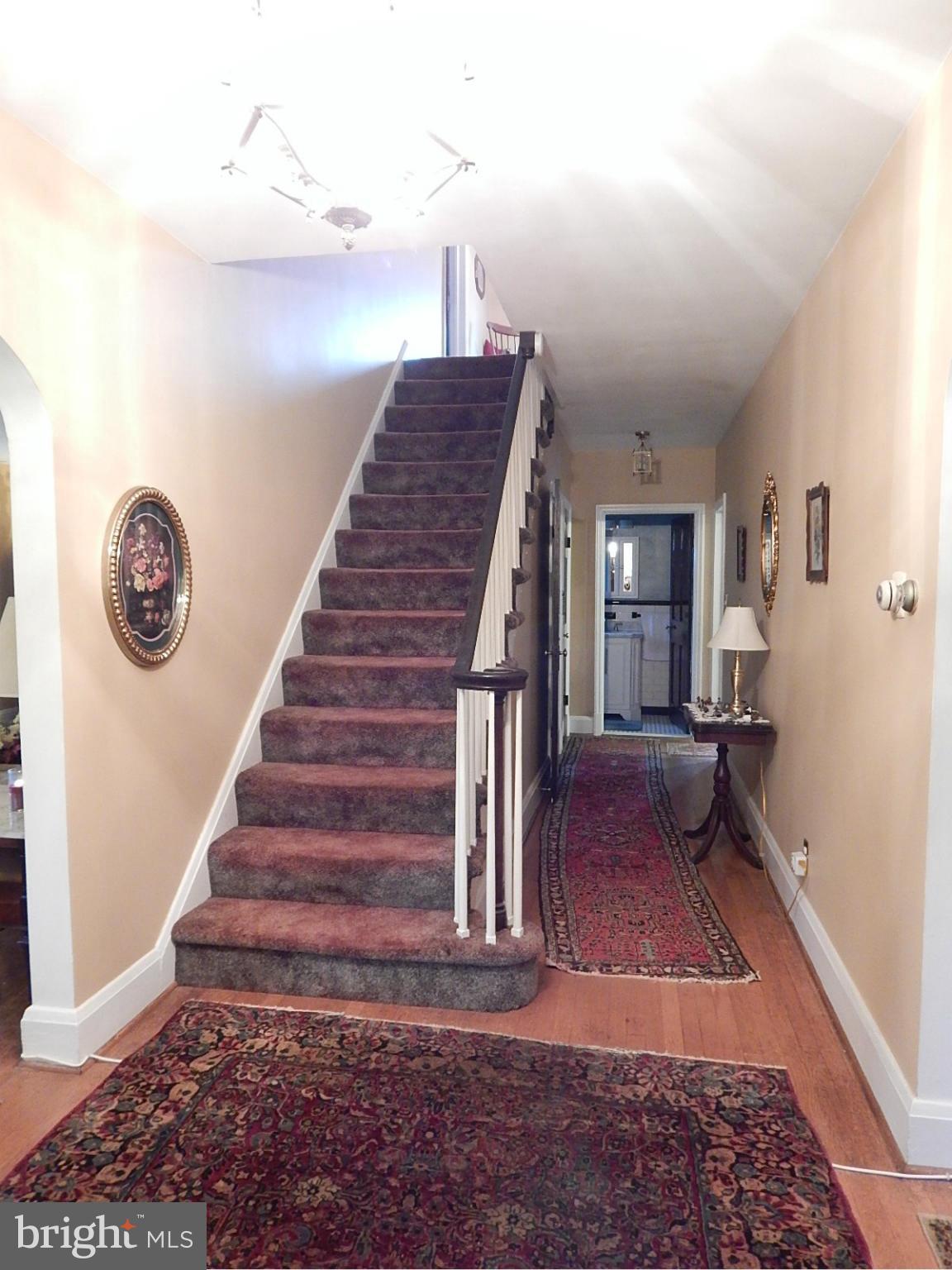7623 Philadelphia Road Baltimore, MD 21237 - Photo 3 of 28 a view of entryway and hall with wooden floor