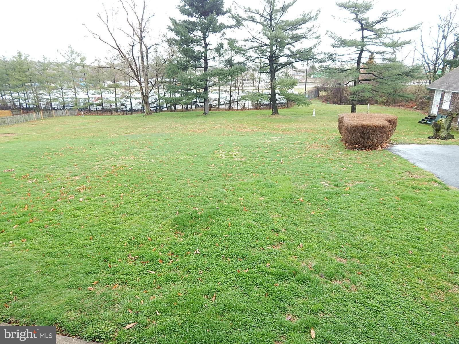 7623 Philadelphia Road Baltimore, MD 21237 - Photo 28 of 28 a view of outdoor space with garden and trees