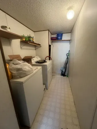 a storage room with washer and dryer