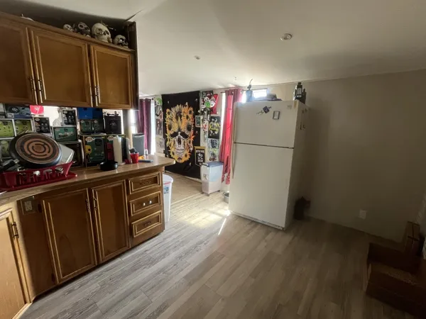 a bathroom with a granite countertop sink mirror vanity and toilet
