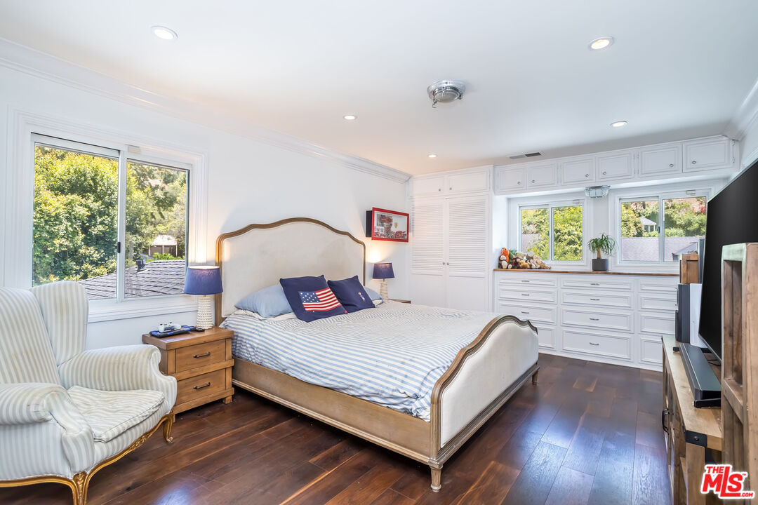 919 Chantilly Road Los Angeles, CA 90077 - Photo 16 of 23 a bedroom with a bed and a large window