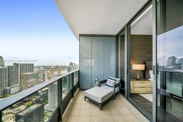 a balcony with furniture and city view