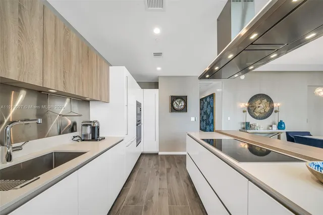 a kitchen with a sink and a stove