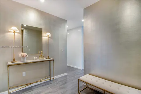 a bathroom with a sink mirror and vanity