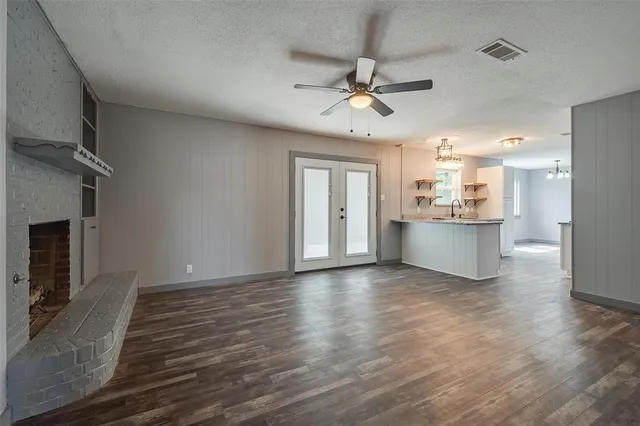 a view of a kitchen with a sink and a kitchen counter top space
