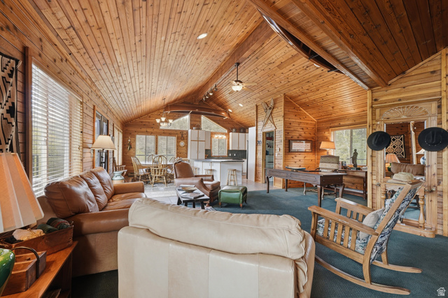 6 Beaver Springs Rancheros Oakley, UT 84055 - Photo 12 of 68 Spacious interior featuring extensive wood paneling on walls and vaulted ceilings, multiple windows, and recessed lighting