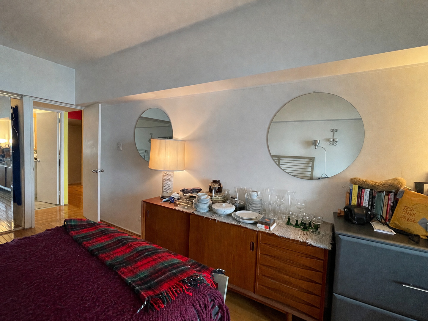 175 East Delaware Place, Unit 5604 Chicago, IL 60611 - Photo 14 of 21 a bedroom with a bed and a dresser with mirror
