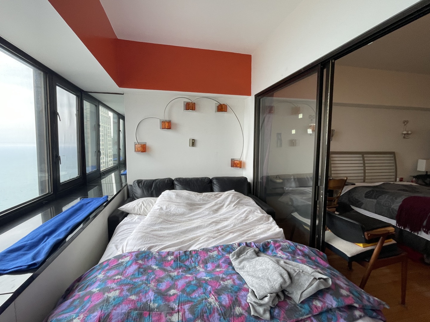 175 East Delaware Place, Unit 5604 Chicago, IL 60611 - Photo 15 of 21 a bed sitting in a bedroom next to a window