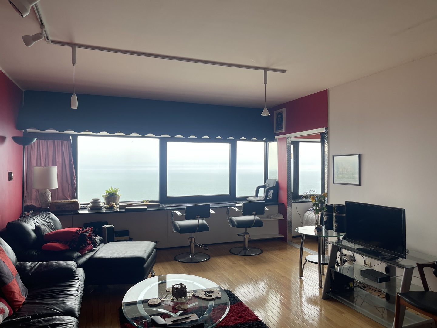 175 East Delaware Place, Unit 5604 Chicago, IL 60611 - Photo 5 of 21 a living room with furniture a flat screen tv and a large window