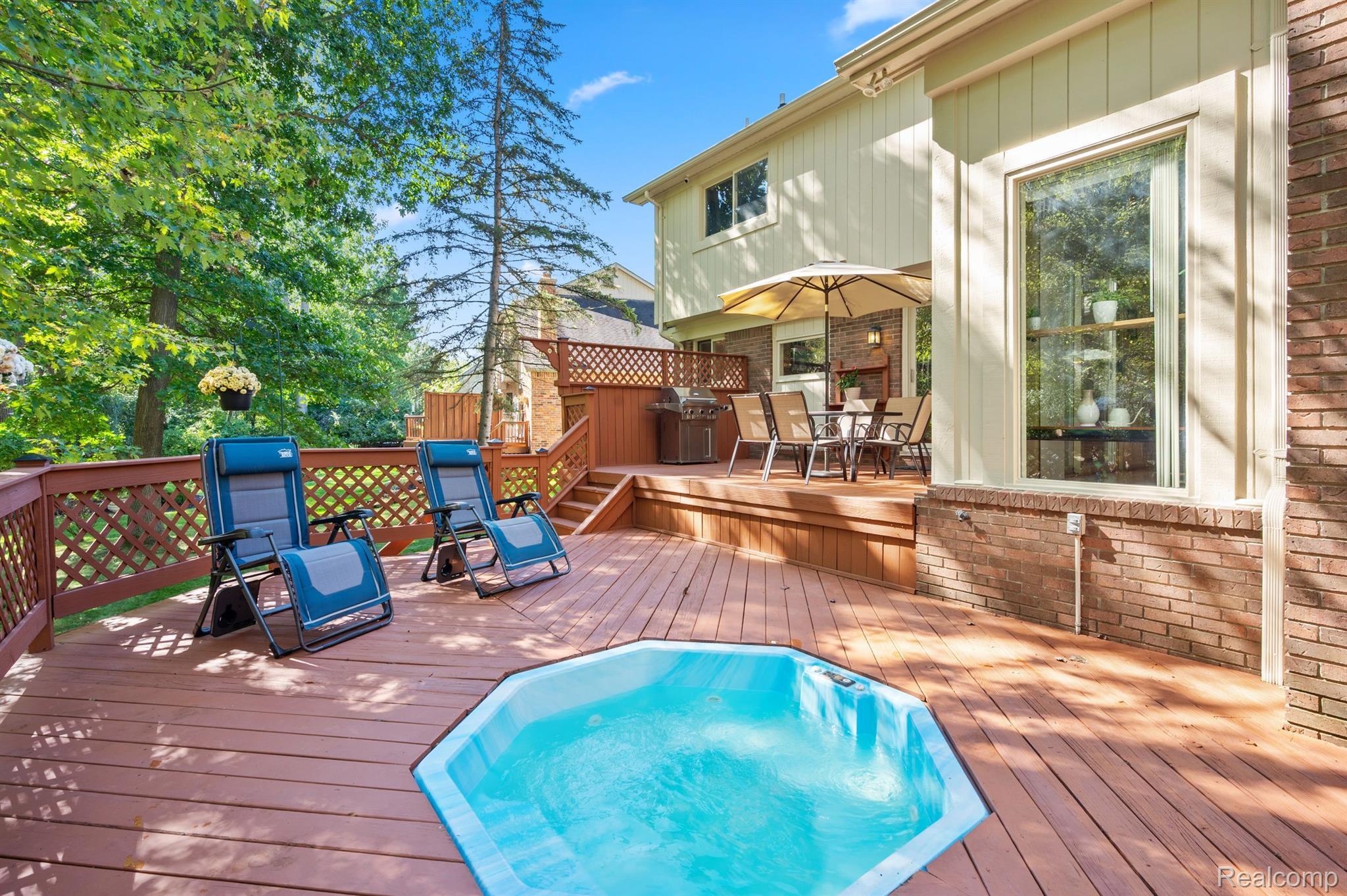 713 River Bend Drive Rochester, MI 48307 - Photo 38 of 68 Two tier deck overlooks a private wooded area