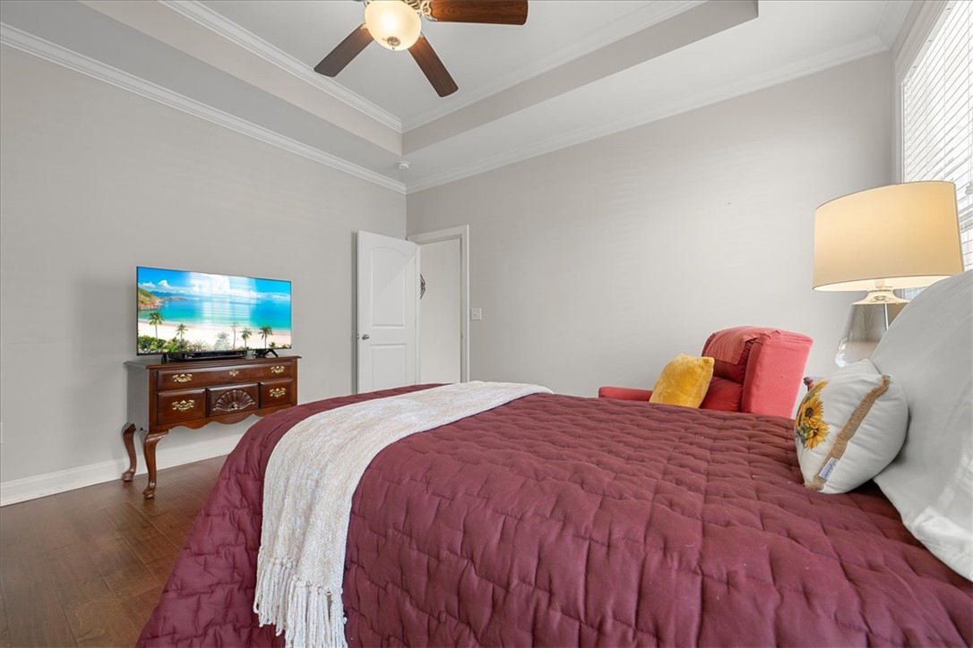 21 Barron Glenn Way Anderson, SC 29621 - Photo 27 of 48 Relax in this tranquil Primary Bedroom featuring rich wood flooring and a distinctive tray ceiling.
