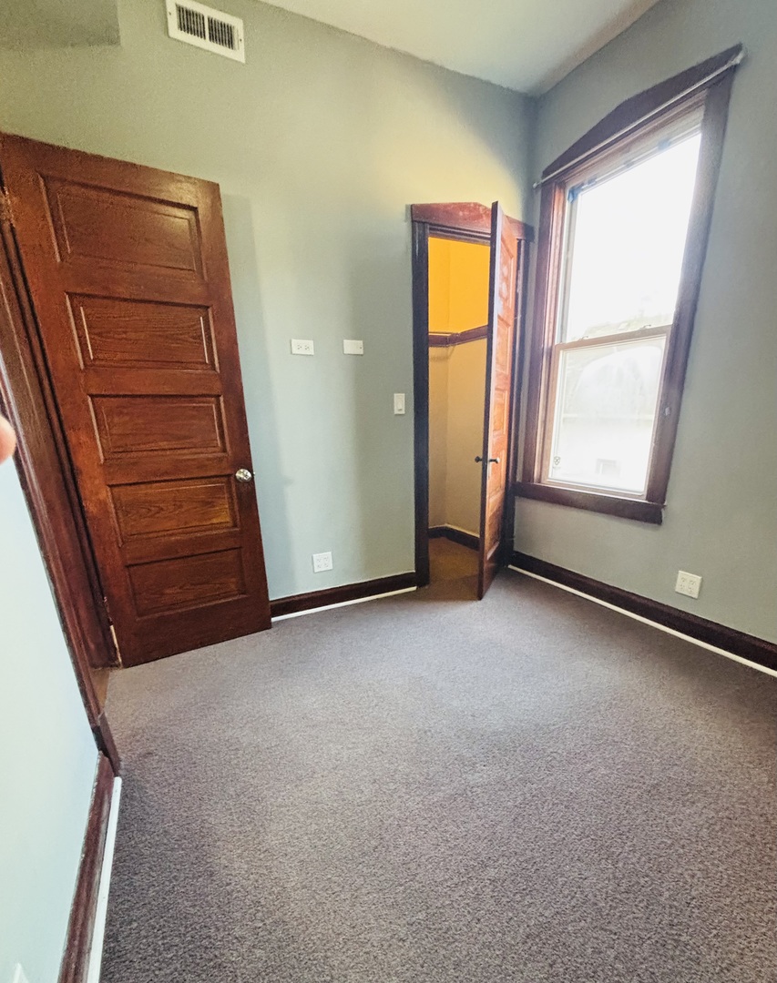 3133 North Richmond Street, Unit 2 Chicago, IL 60618 - Photo 13 of 16 an empty room with windows