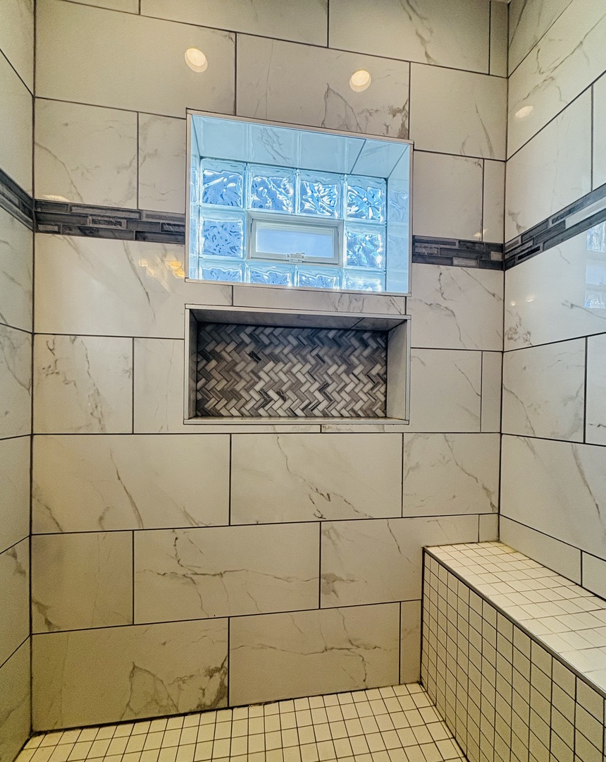 3133 North Richmond Street, Unit 2 Chicago, IL 60618 - Photo 5 of 16 a bathroom with a sink a toilet and a shower