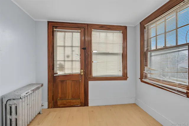 a view of an empty room with a window