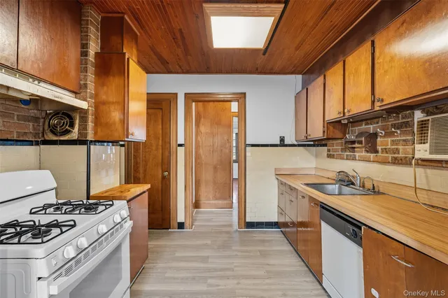 a kitchen with stainless steel appliances granite countertop a stove and a refrigerator