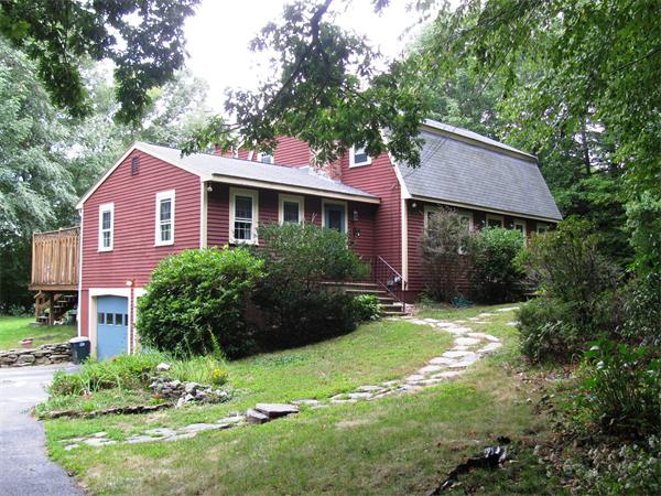276 Mendon Road Sutton, MA 01590 - Photo 1 of 1 a front view of a house with a yard