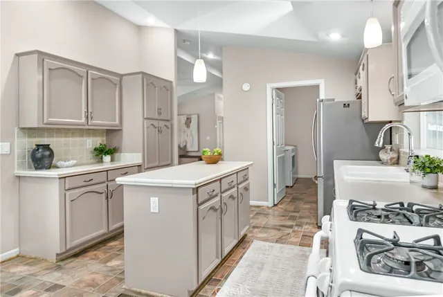 a view of a dining room with furniture and windows