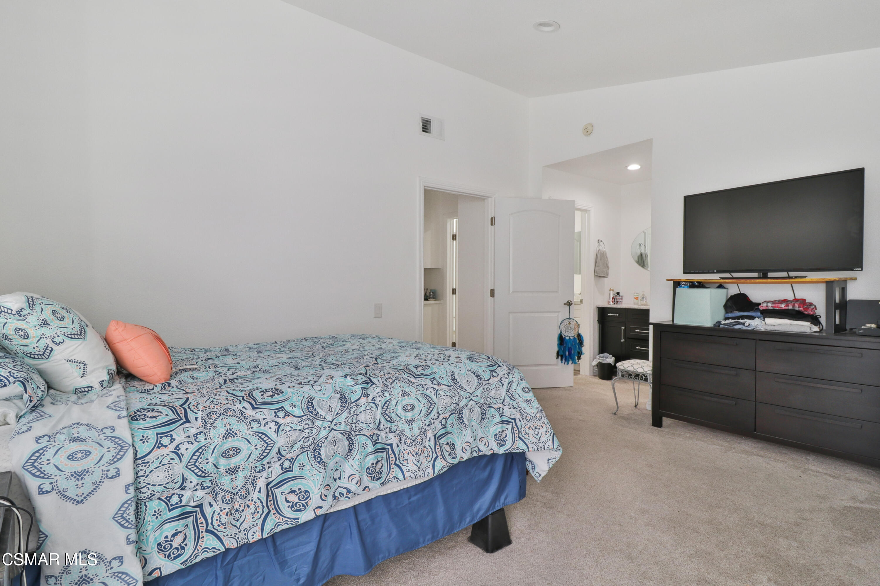 5239 Perkins Road Oxnard, CA 93033 - Photo 14 of 25 a bedroom with a bed and a flat screen tv
