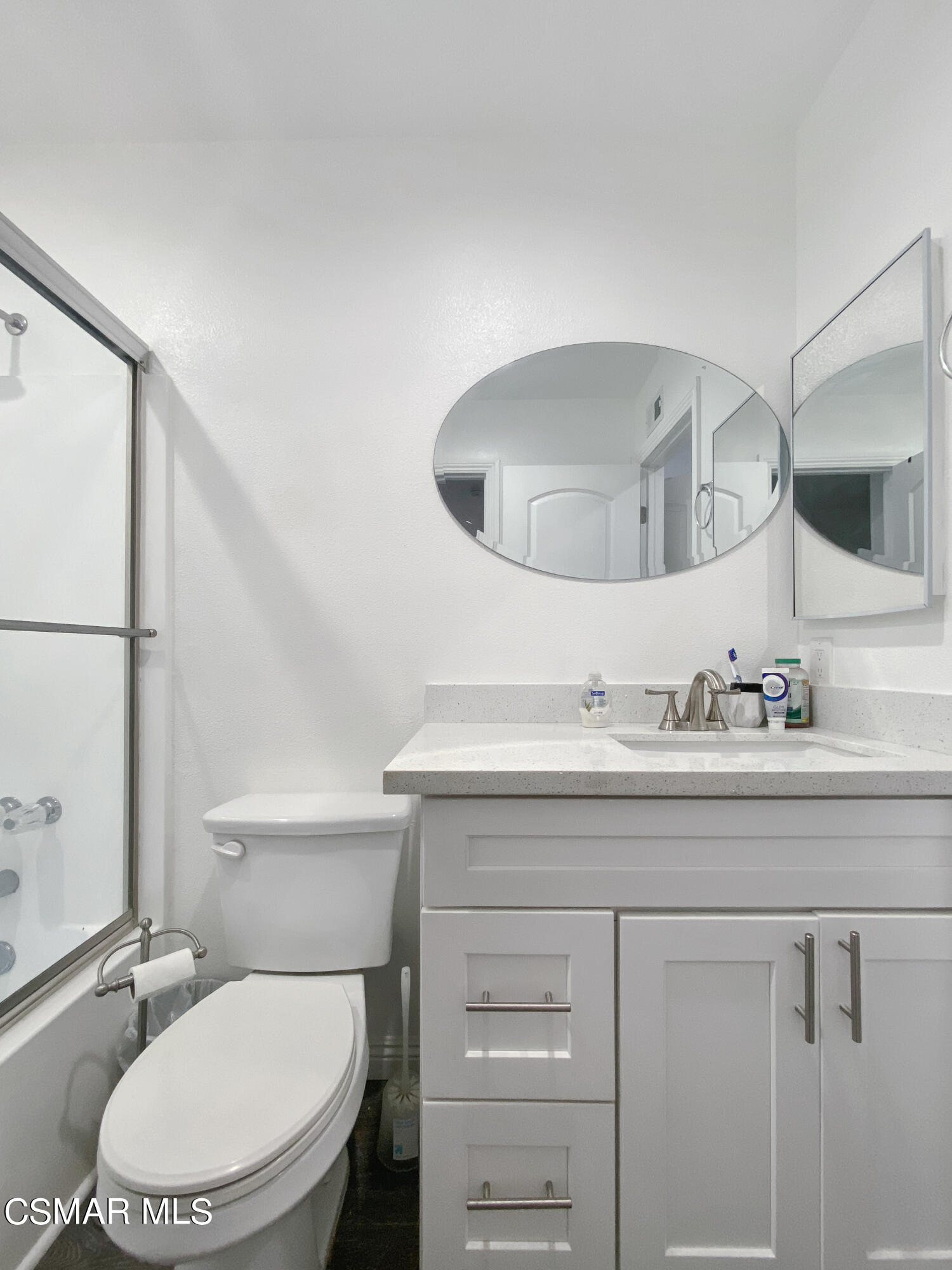 5239 Perkins Road Oxnard, CA 93033 - Photo 15 of 25 a bathroom with a granite countertop toilet sink and mirror