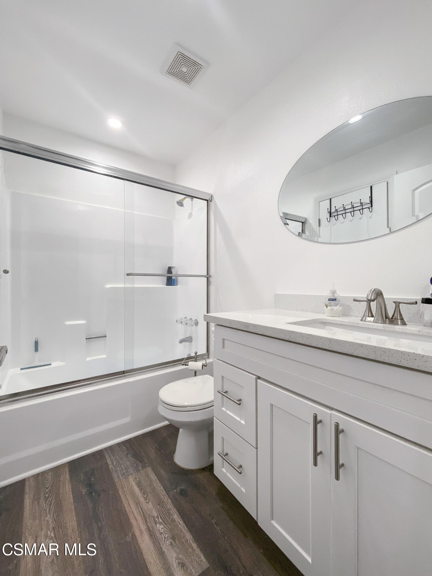 5239 Perkins Road Oxnard, CA 93033 - Photo 16 of 25 a bathroom with a toilet sink a mirror and a shower