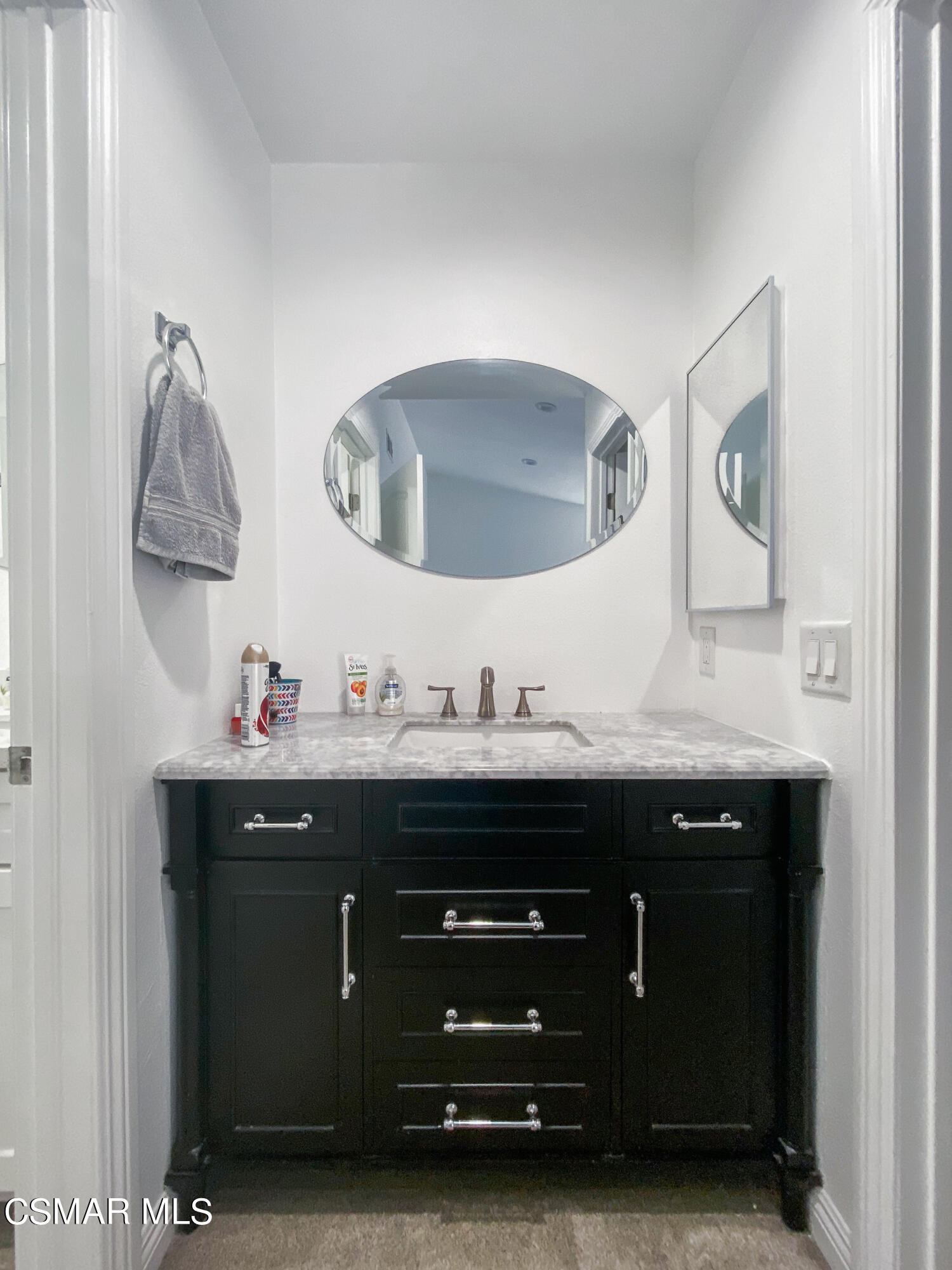 5239 Perkins Road Oxnard, CA 93033 - Photo 17 of 25 a bathroom with a sink and a mirror