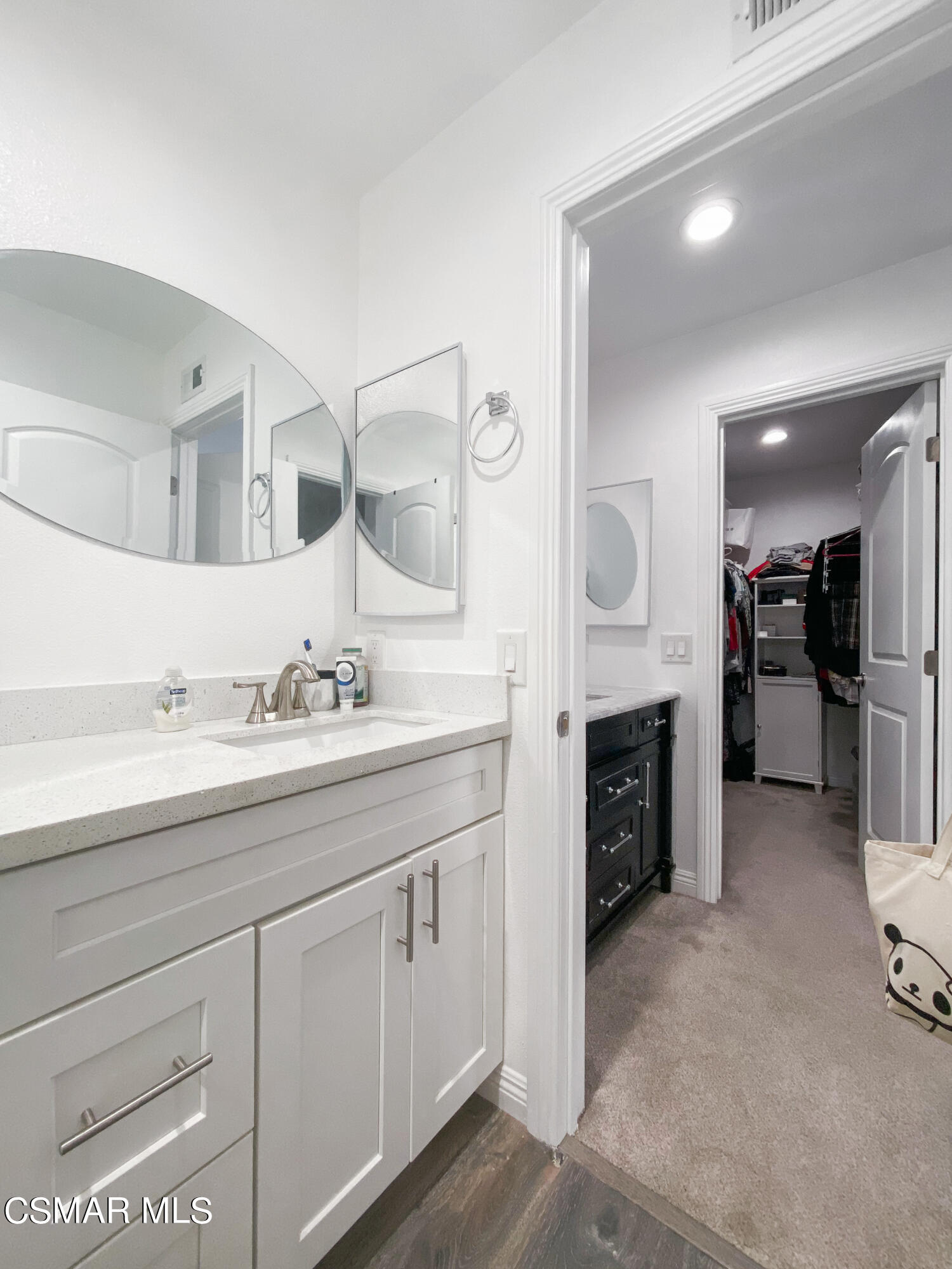 5239 Perkins Road Oxnard, CA 93033 - Photo 20 of 25 a spacious bathroom with a double vanity sink double and a mirror
