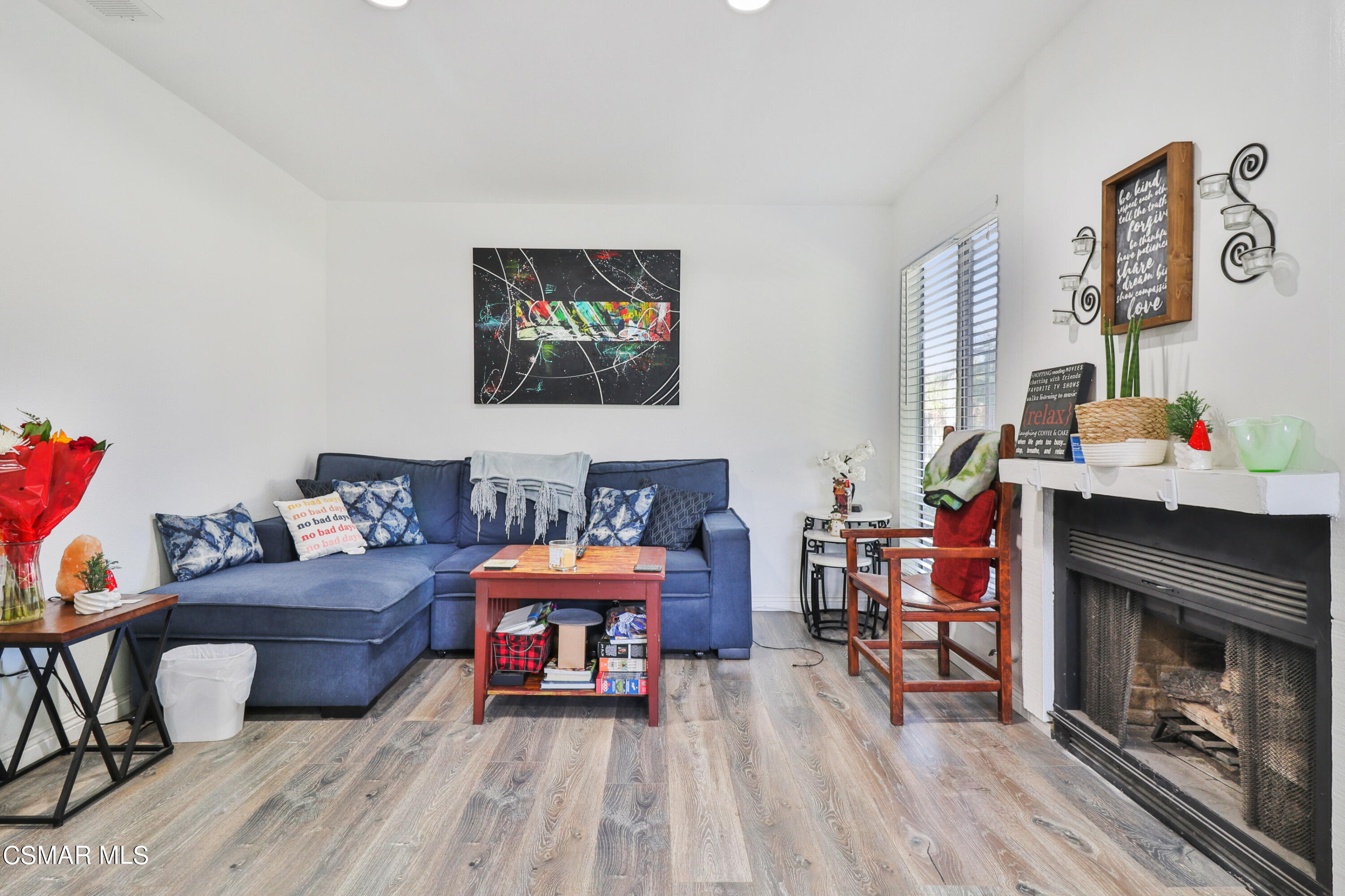 5239 Perkins Road Oxnard, CA 93033 - Photo 3 of 25 a living room with furniture and a fireplace