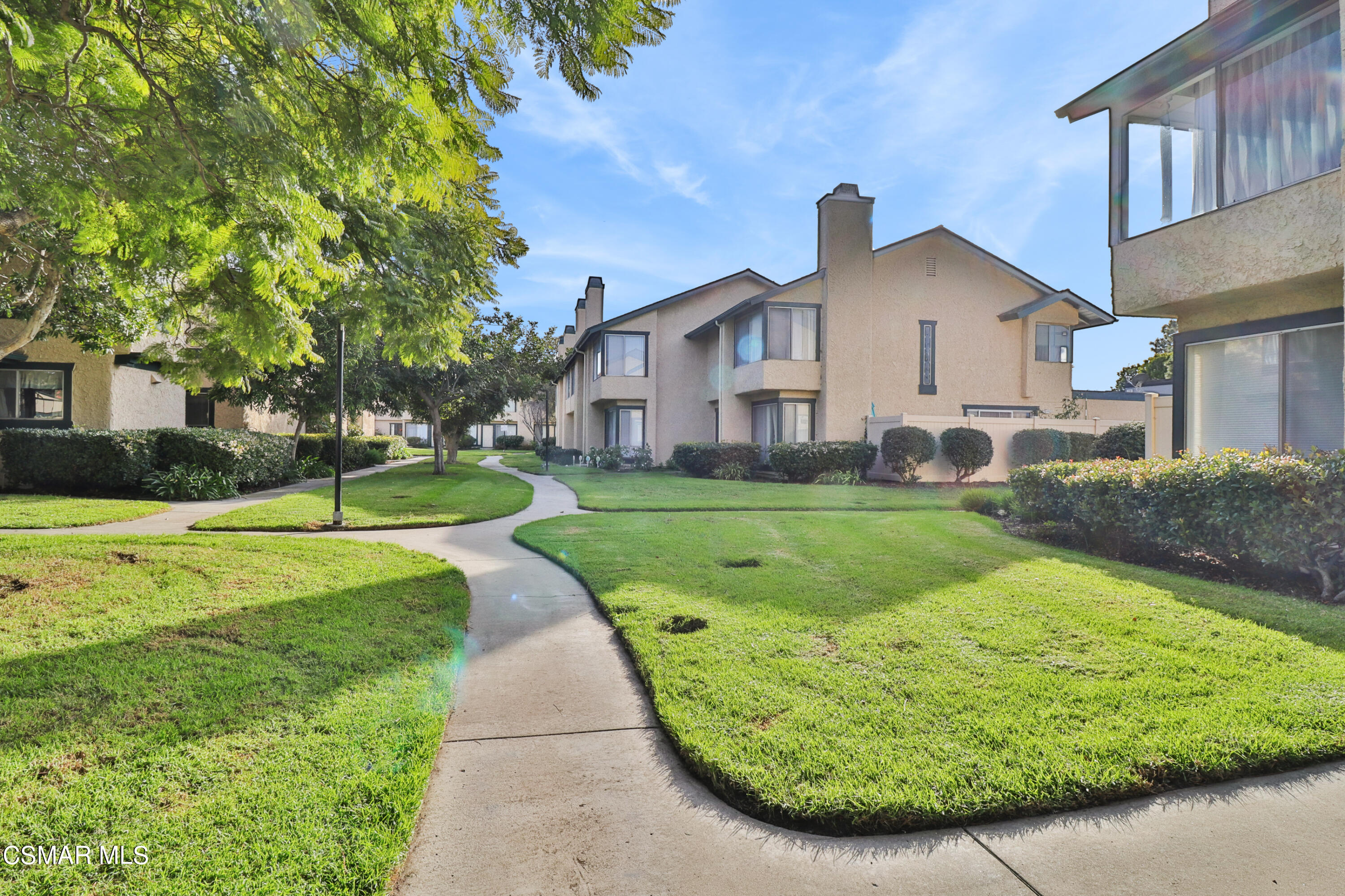 5239 Perkins Road Oxnard, CA 93033 - Photo 22 of 25 a view of a house with a yard and potted plants