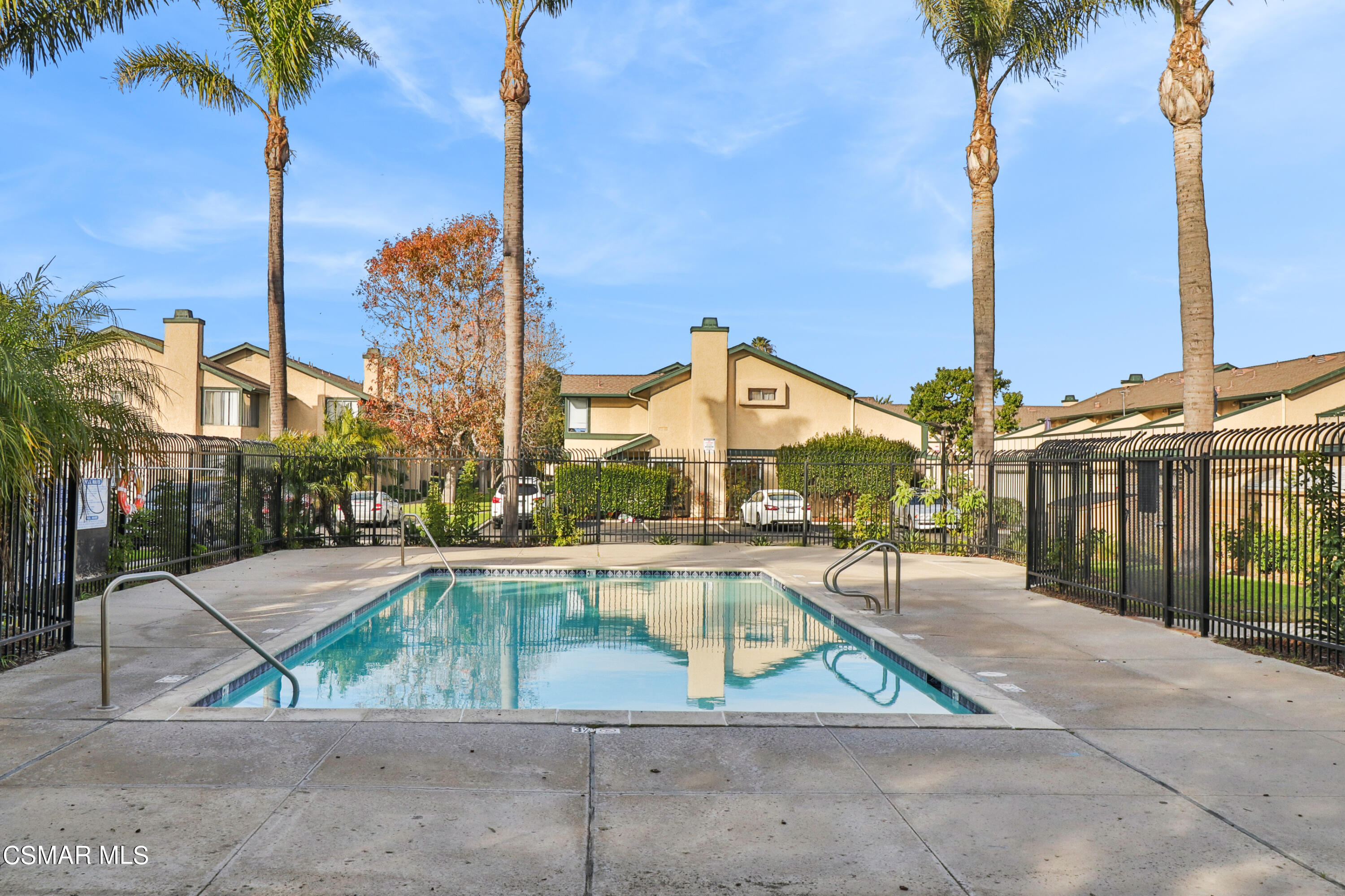 5239 Perkins Road Oxnard, CA 93033 - Photo 24 of 25 a view of pool with lawn chairs and palm tree