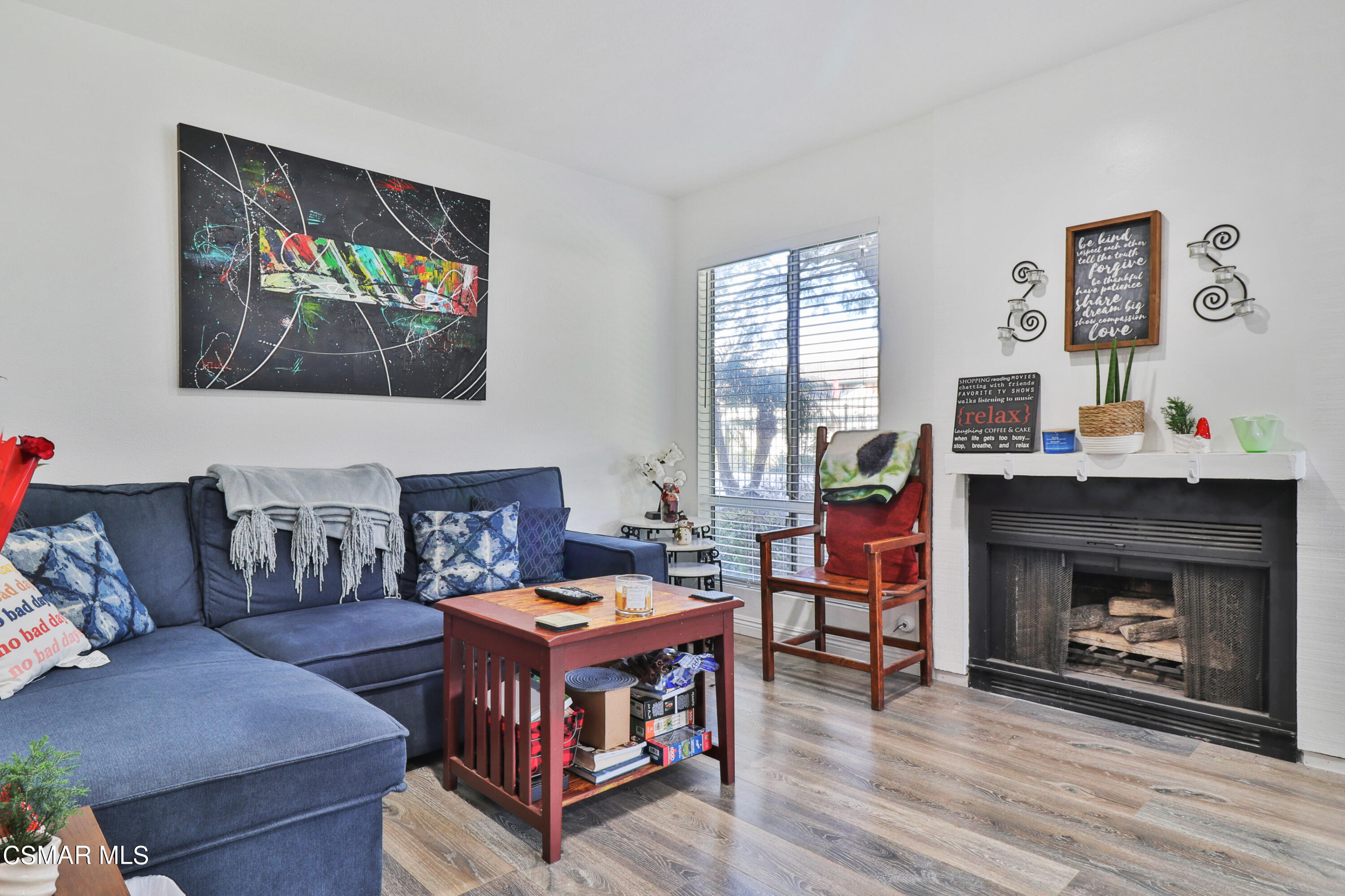 5239 Perkins Road Oxnard, CA 93033 - Photo 4 of 25 a living room with furniture and a fireplace
