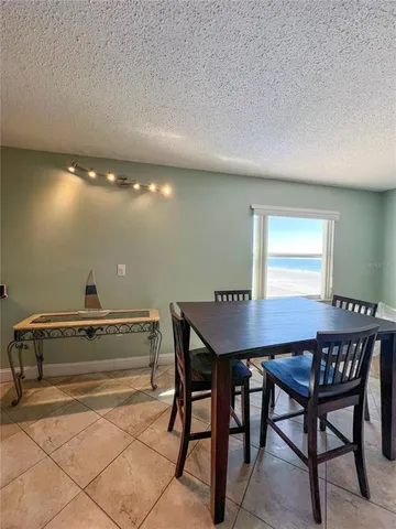a dining room with a table and chairs