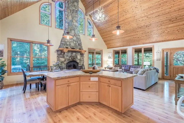 a large white kitchen with a large window