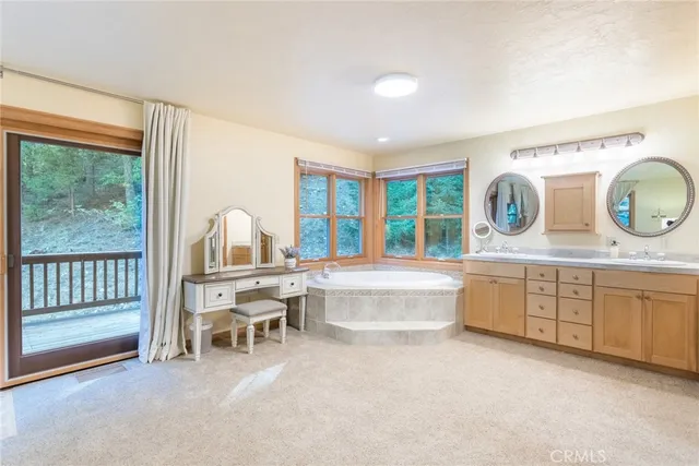 a large white kitchen with a large window