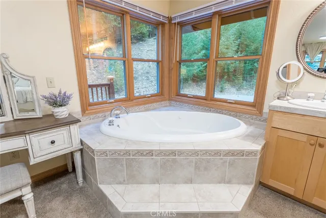 a bathroom with bathtub and window