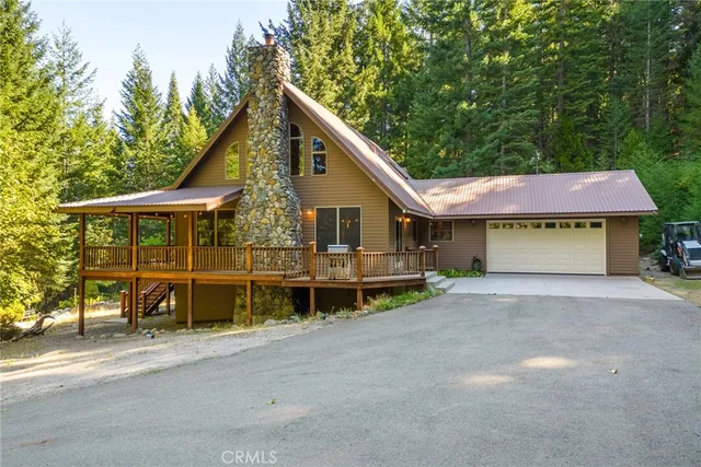 a view of a house with a yard and balcony