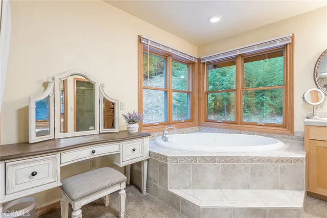 a bathroom with a bathtub and a window