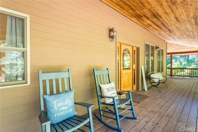 a view of two chairs in the balcony
