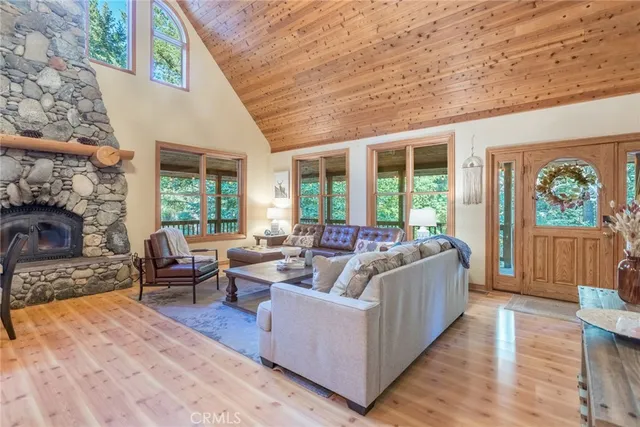 a living room with furniture and large windows