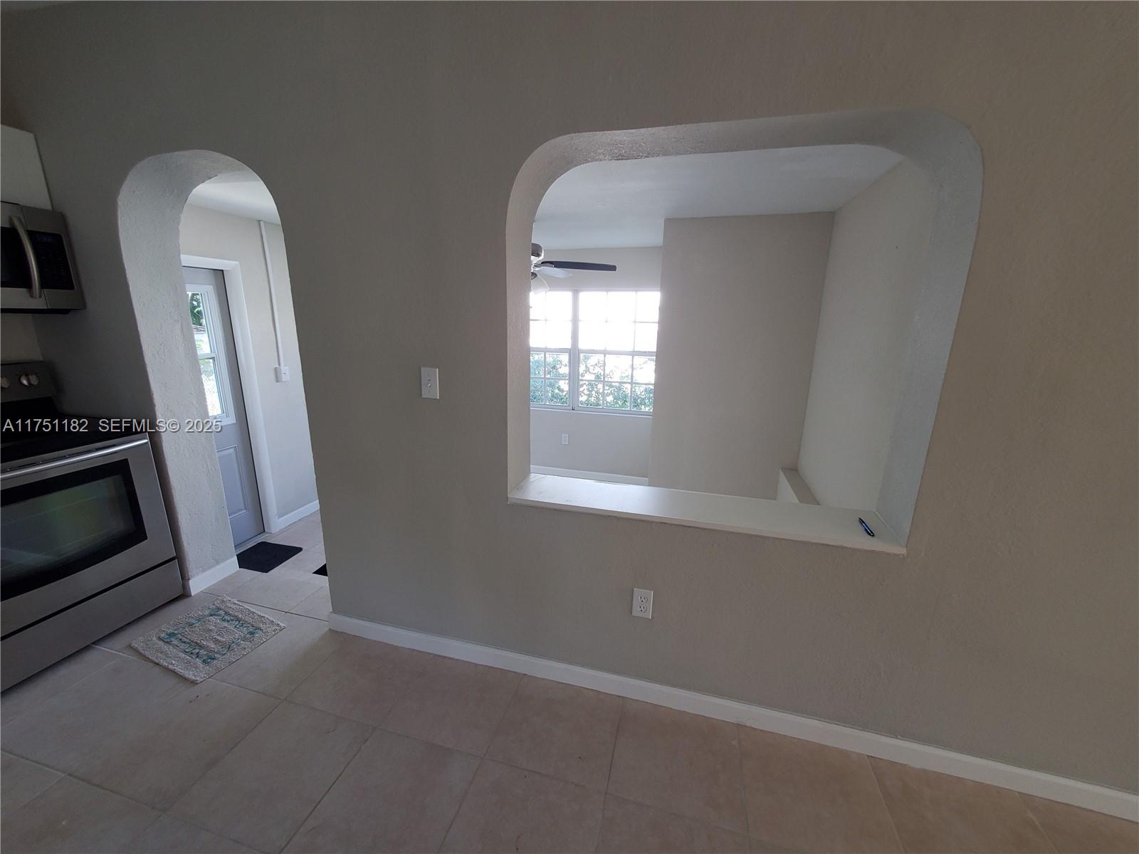 70 Northwest 33rd Street Miami, FL 33127 - Photo 12 of 48 an empty room with windows