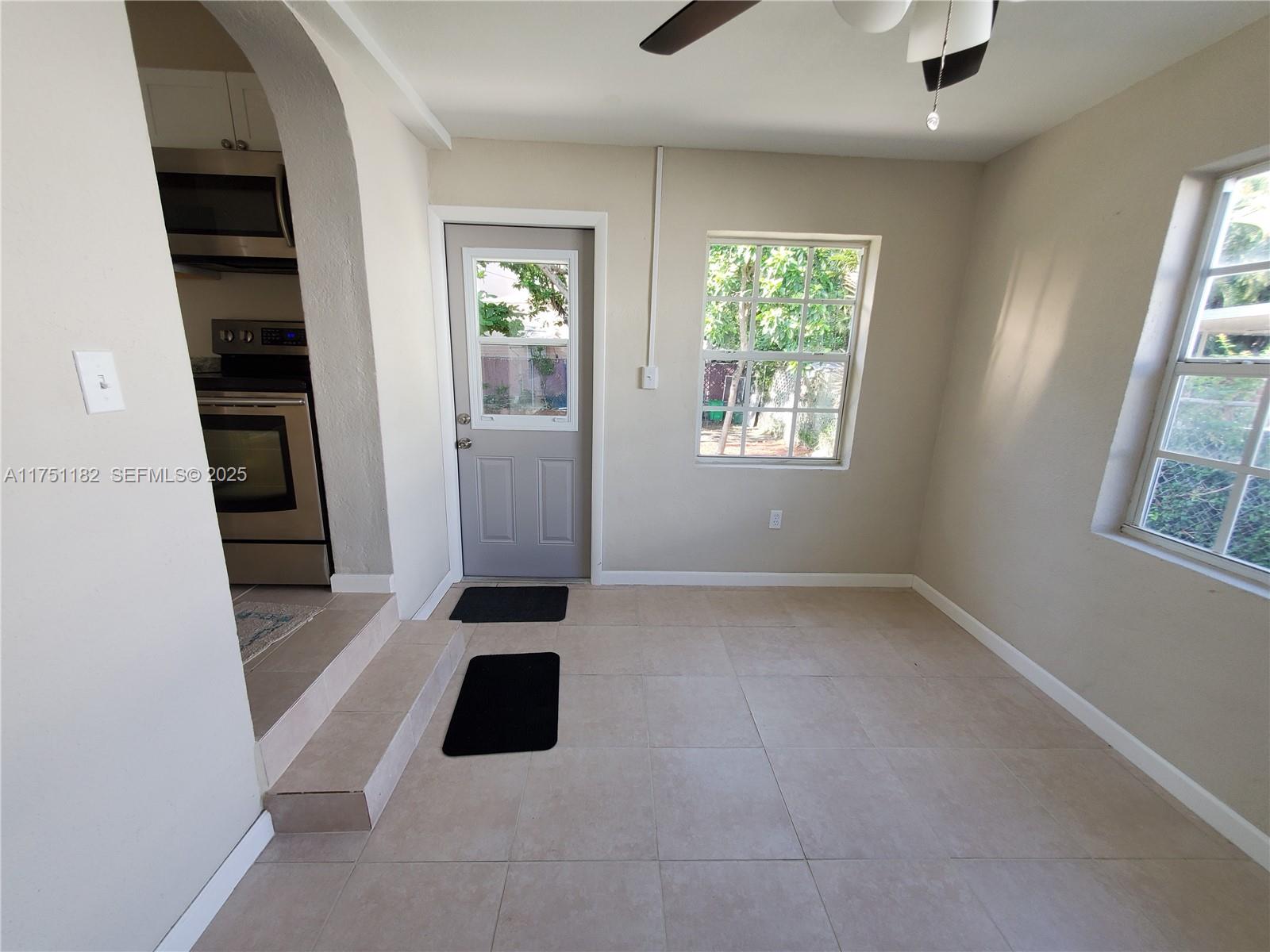 70 Northwest 33rd Street Miami, FL 33127 - Photo 19 of 48 an empty room with windows