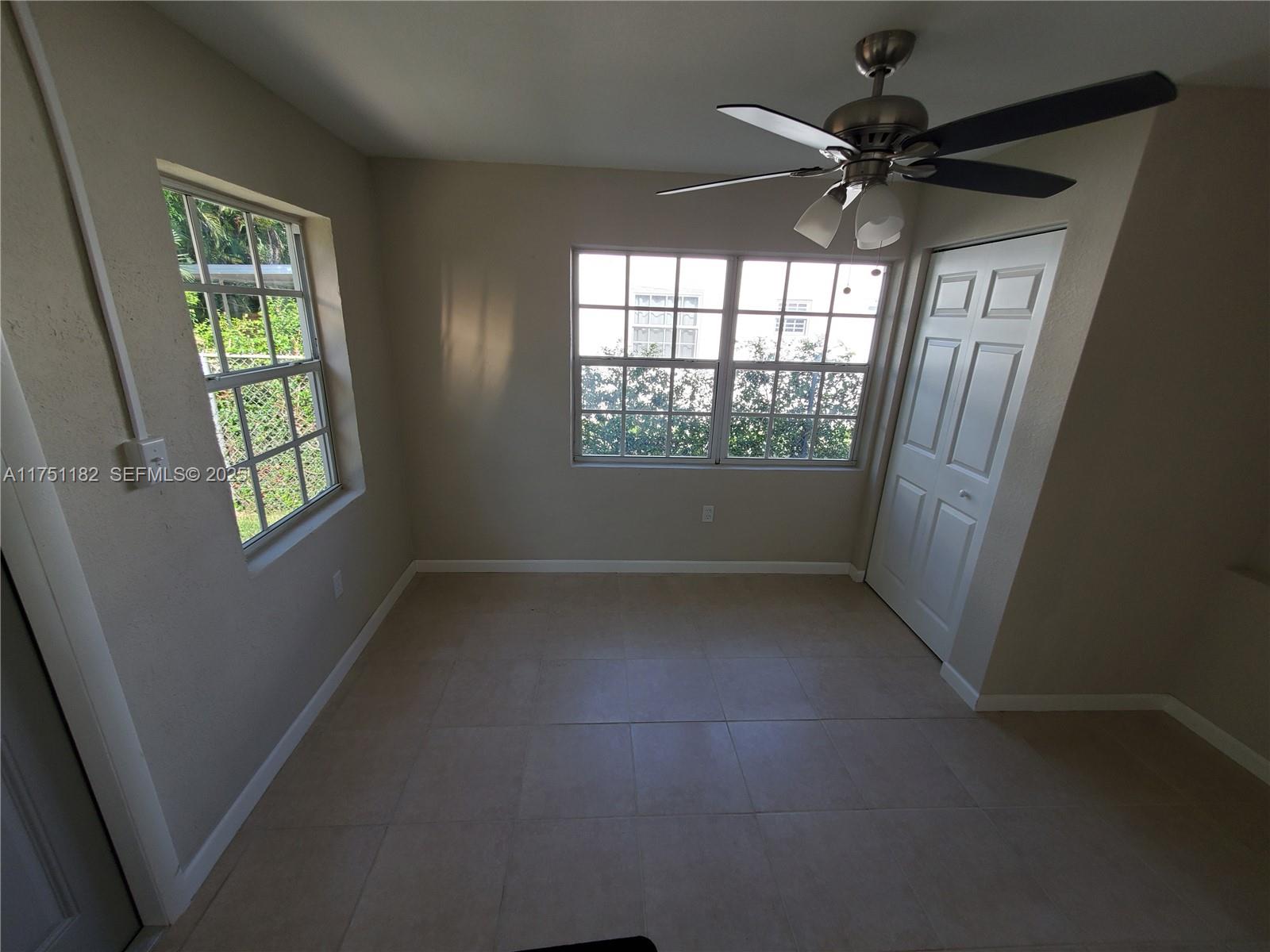 70 Northwest 33rd Street Miami, FL 33127 - Photo 20 of 48 an empty room with windows and fan