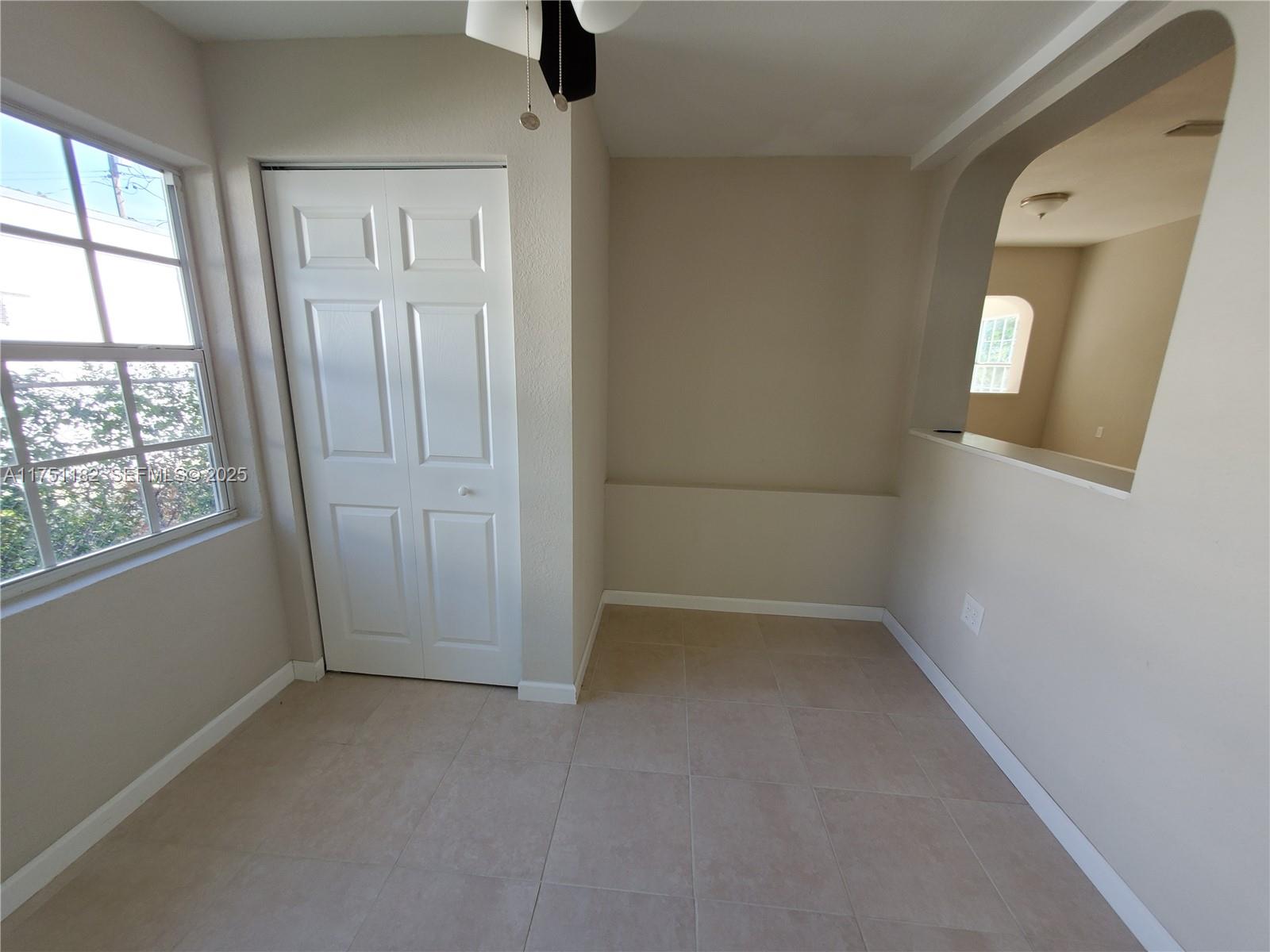 70 Northwest 33rd Street Miami, FL 33127 - Photo 21 of 48 an empty room with windows and closet